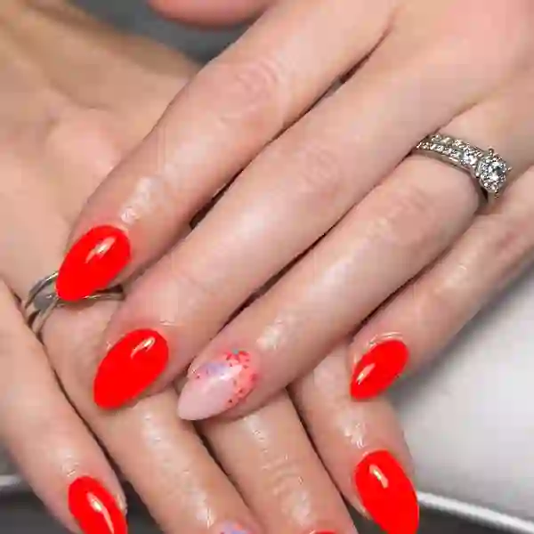 Red almond gel nails with floral accent
