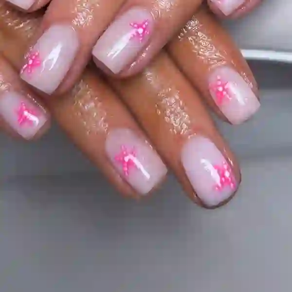 Nude builder-gel nails with pink star nail art